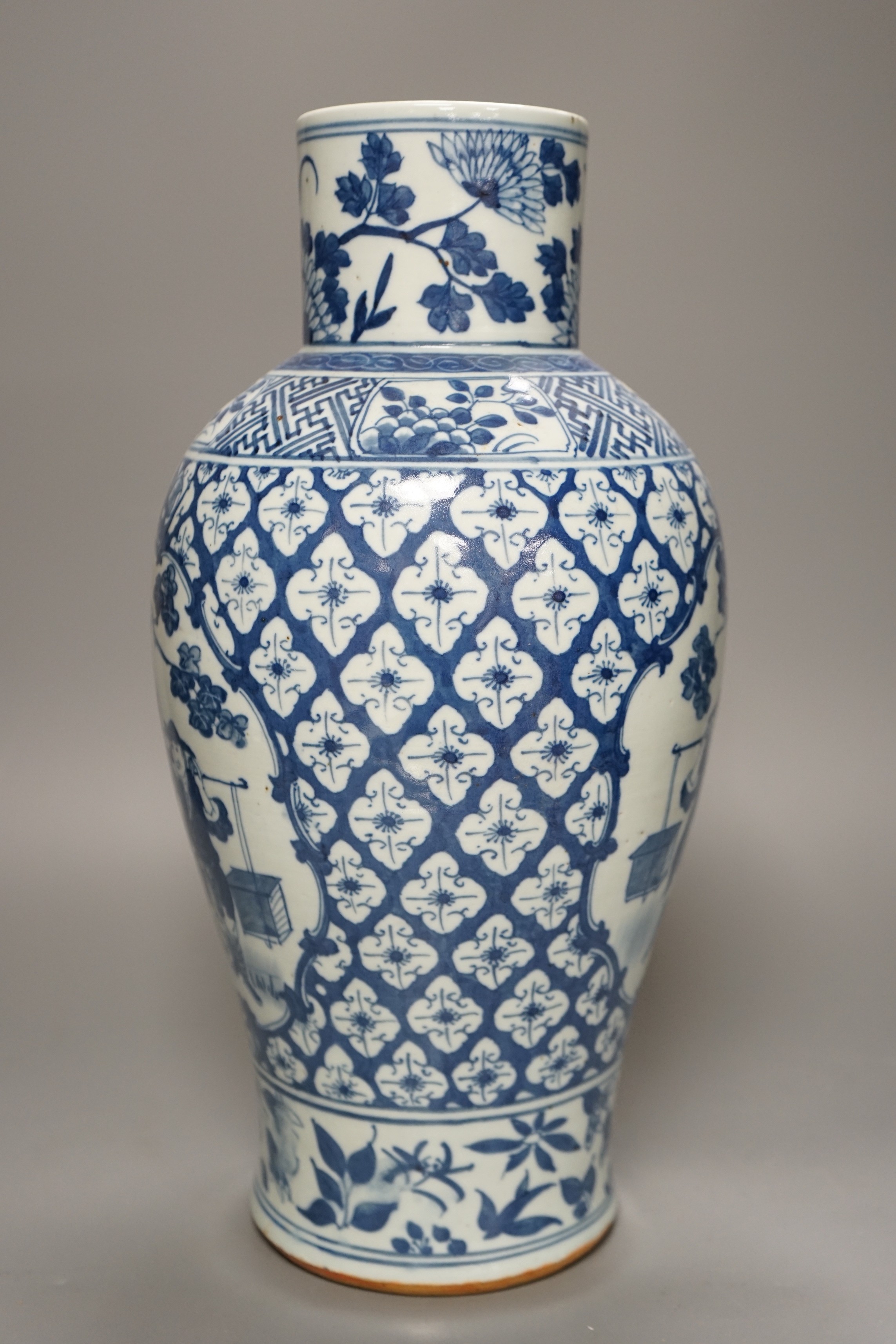A 19th century Chinese blue and white 'Tradesmen' vase, 40cm